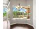 Dining area displays dark wood floors and a corner view of the screened pool at 4521 Cheval Blvd, Lutz, FL 33558
