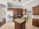 Gourmet kitchen with stainless steel appliances and custom wood cabinetry at 4521 Cheval Blvd, Lutz, FL 33558