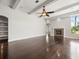 Open floor plan with hardwood floors, fireplace, and recessed lighting throughout the room at 4521 Cheval Blvd, Lutz, FL 33558