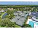 Aerial view of community tennis courts and a pool offering residents many opportunities for recreation at 4521 Cheval Blvd, Lutz, FL 33558