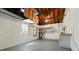 Unfinished basement features open rafters, painted walls, and sealed floor for a clean appearance at 4611 W Bay Court Avenue, Tampa, FL 33611