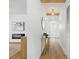 Bright hallway featuring wood floors, recessed lighting, and a stylish console table at 4611 W Bay Court Avenue, Tampa, FL 33611
