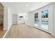 Bright sunroom featuring white cabinets, view of the pool through French doors and tile floors at 4611 W Bay Court Avenue, Tampa, FL 33611