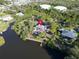 Picturesque waterfront home with pool and dock, nestled on lush land with easy access to water activities at 4915 South Rd, New Port Richey, FL 34652
