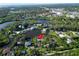 Beautiful aerial view of home on canal, surrounded by lush greenery and waterfront views at 4915 South Rd, New Port Richey, FL 34652