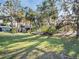 Expansive backyard with mature trees and lush lawn at 4915 South Rd, New Port Richey, FL 34652