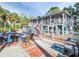 Charming two-story home featuring a refreshing backyard pool and a comfortable outdoor seating area at 4915 South Rd, New Port Richey, FL 34652