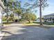 Spacious driveway with ample parking space and mature trees at 4915 South Rd, New Port Richey, FL 34652
