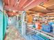 Open garage space with exposed beams, offering potential for storage or workshop activities at 4915 South Rd, New Port Richey, FL 34652