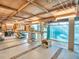 Garage featuring a workbench, shelving, and ample space for projects and storage at 4915 South Rd, New Port Richey, FL 34652