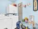 Laundry room with washer and dryer, storage cabinets, and countertop space at 4915 South Rd, New Port Richey, FL 34652