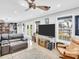 Open concept living room with a large sectional and canal view at 4915 South Rd, New Port Richey, FL 34652