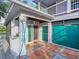 Outdoor shower with tile flooring and exterior access at 4915 South Rd, New Port Richey, FL 34652