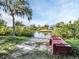 Waterfront property featuring a dock and access to a calm canal at 4915 South Rd, New Port Richey, FL 34652