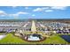 An aerial view of the community, green space, and neighborhood pool at 5474 Flint Hills Dr, Wimauma, FL 33598