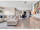Spacious living room with modern decor and an open view to the kitchen at 5474 Flint Hills Dr, Wimauma, FL 33598