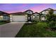 Charming single-Gathering home featuring a two-car garage, well-manicured lawn, and inviting curb appeal at 8077 Tea Olive Ter, Palmetto, FL 34221