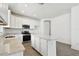 Well-lit kitchen showcasing granite counters, a central island, stainless steel appliances, and ample cabinet space at 8077 Tea Olive Ter, Palmetto, FL 34221