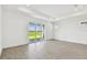 Bright living room with tiled flooring and a large sliding glass door leading to outdoor space at 8077 Tea Olive Ter, Palmetto, FL 34221
