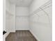 A large walk-in closet with carpeted floors and wire shelving offers ample storage space at 8077 Tea Olive Ter, Palmetto, FL 34221