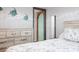Bedroom features cool blue ocean-themed decor at 108 W Saint Johns Way # 210, Apollo Beach, FL 33572