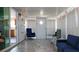 Bonus room featuring a blue chair and sofa with white walls at 108 W Saint Johns Way # 210, Apollo Beach, FL 33572