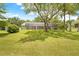 Expansive backyard featuring a large screened-in porch perfect for outdoor living at 1271 Candlelight Blvd, Brooksville, FL 34601