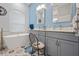 Modern bathroom featuring dual sinks, stylish tile, and updated lighting at 1271 Candlelight Blvd, Brooksville, FL 34601