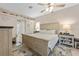 Bright bedroom featuring a ceiling fan, stylish furnishings, and hardwood flooring at 1271 Candlelight Blvd, Brooksville, FL 34601