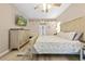 Cozy bedroom with a dresser, TV, and comfortable king size bed at 1271 Candlelight Blvd, Brooksville, FL 34601