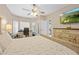 Bright bedroom featuring a ceiling fan, stylish furnishings, and hardwood flooring at 1271 Candlelight Blvd, Brooksville, FL 34601
