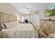 Bright bedroom featuring a ceiling fan, stylish furnishings, and hardwood flooring at 1271 Candlelight Blvd, Brooksville, FL 34601