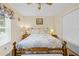 Neutral bedroom with ceiling fan, bed, night stands, window, closet, and wood floors at 1271 Candlelight Blvd, Brooksville, FL 34601