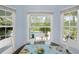 Bright breakfast nook with windows overlooking the pool and backyard at 1271 Candlelight Blvd, Brooksville, FL 34601