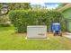 Residential generator in the backyard with lush landscaping and fencing at 1271 Candlelight Blvd, Brooksville, FL 34601
