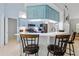 Kitchen featuring bar seating, light blue cabinetry, and lots of countertop space at 1271 Candlelight Blvd, Brooksville, FL 34601