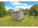 Convenient storage shed in the backyard offering ample space for tools and equipment at 1271 Candlelight Blvd, Brooksville, FL 34601