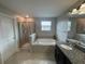 Bathroom featuring a separate shower and large soaking tub at 1596 Ludington Ave, Wesley Chapel, FL 33543
