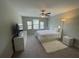 Bright bedroom with a plush white rug and a ceiling fan at 1596 Ludington Ave, Wesley Chapel, FL 33543