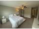 Spacious bedroom with ceiling fan, neutral walls, and carpeted floor at 1596 Ludington Ave, Wesley Chapel, FL 33543