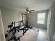 Exercise room with ceiling fan and various workout machines at 1596 Ludington Ave, Wesley Chapel, FL 33543
