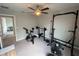 Bright exercise room features ceiling fan and variety of fitness equipment, great for home workouts at 1596 Ludington Ave, Wesley Chapel, FL 33543