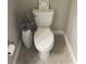 Clean, modern toilet with decorative accents at 1596 Ludington Ave, Wesley Chapel, FL 33543
