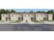 Well-maintained row of townhomes, offering individual garages and beautifully landscaped yards at 17265 English Chestnut Way, Land O Lakes, FL 34638