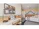 A styled bedroom with desk, wall decor, and coordinating bedding create a functional and aesthetically pleasing space at 17469 Spanish Oak Loop, Land O Lakes, FL 34638