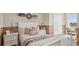 A bedroom decorated with auto-themed decor, paired with stylish furniture, creates an inviting personal retreat at 17469 Spanish Oak Loop, Land O Lakes, FL 34638