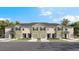 Charming townhomes featuring individual garages and neutral exteriors perfect for modern living at 17469 Spanish Oak Loop, Land O Lakes, FL 34638