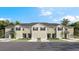 Charming townhomes featuring individual garages and light exteriors perfect for modern living at 17469 Spanish Oak Loop, Land O Lakes, FL 34638