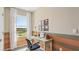 Home office featuring a sleek desk, car-themed wall art, and a comfortable chair, perfect for studying at 17477 Spanish Oak Loop, Land O Lakes, FL 34638