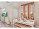 Bright dining area features a white dining table and decorative mirrors at 17481 Spanish Oak Loop, Land O Lakes, FL 34638